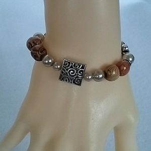 Safari bead,flower, and ivory beaded stretch bracelet